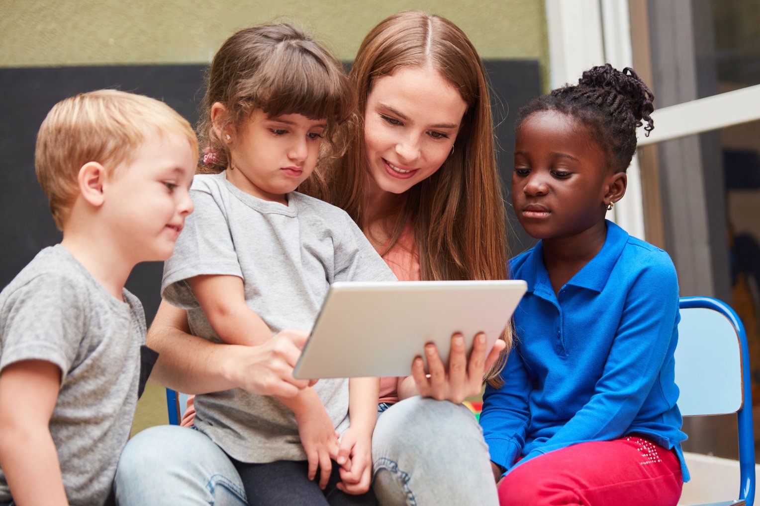 Children and Teacher Are Reading 