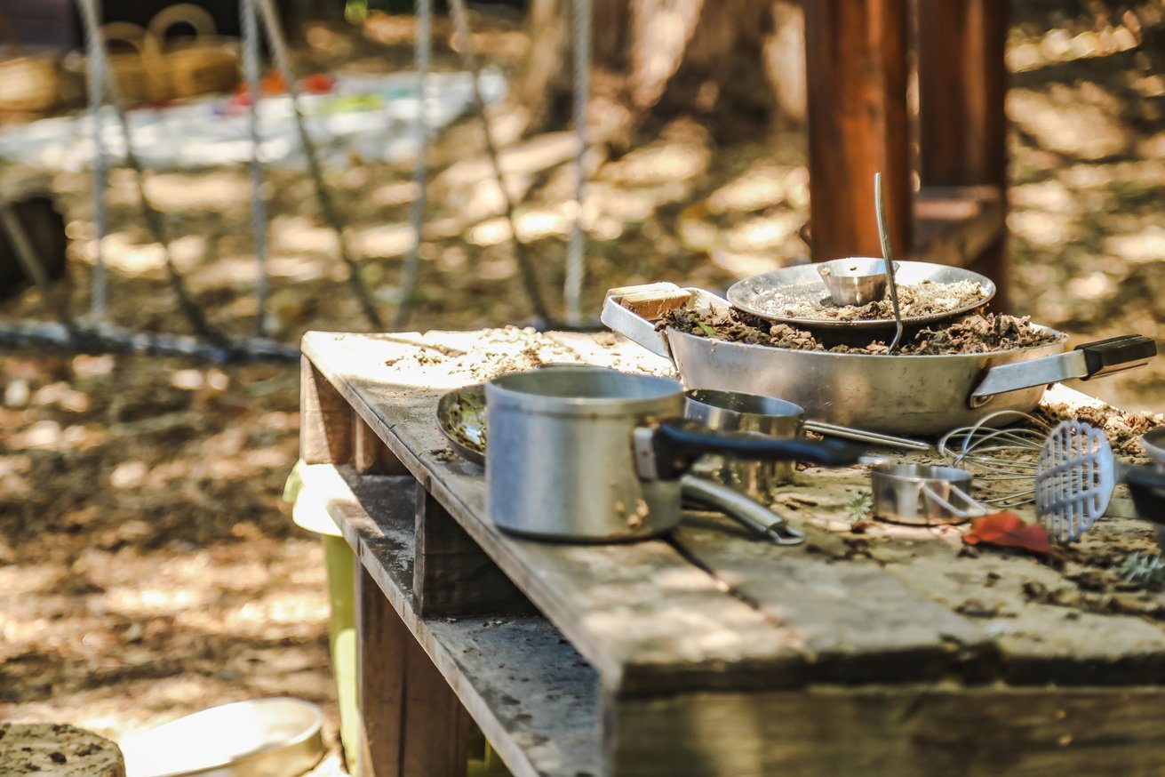 Mud kitchen in tropical preschool garden. Kindergarten yard in Queensland Australia.